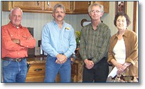 Wesley Emerson, CEO of Emerson Oil Company, visits with employee Ann Burton (right), and Lynn and Donnie (left) with Stampede Trucking of El Dorado, a common carrier used by Emerson to haul fuel. Wesley attributed the companys continued success to their faithful customers and dedicated employees, and he pledged to continue to put their customers first.