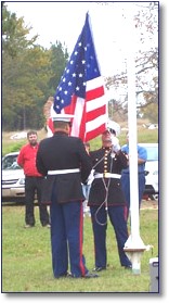 U.S. Marines from Shreveport raise the American flag.