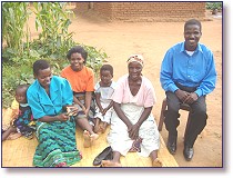 Semu Kamowa (right) is director of the Rainbow Childrens Development Center, the orphanage in Malawi. He is shown here with his mom, wife, sister (Gilberts mother), and two local children.